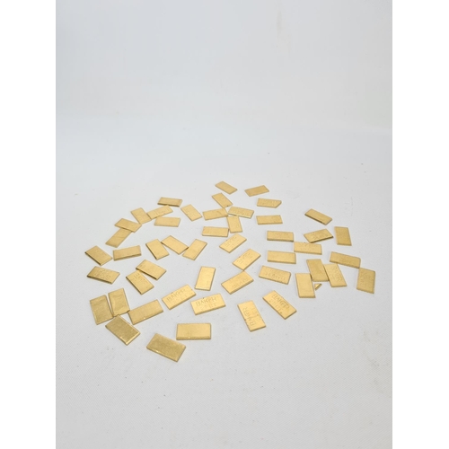 62 - Fifty 22ct gold tooth caps/grills - approx. weight 100 grams