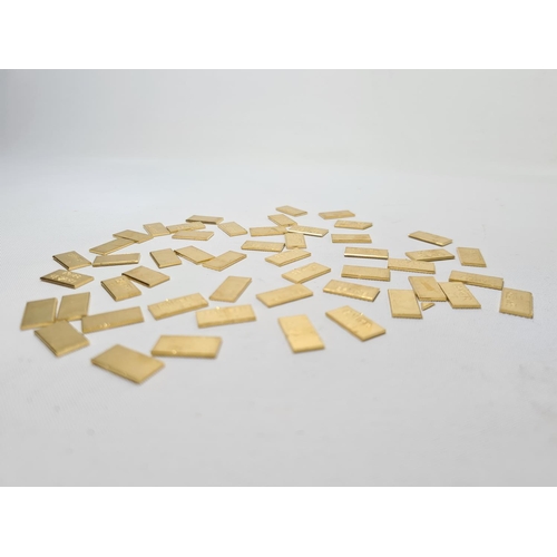 62 - Fifty 22ct gold tooth caps/grills - approx. weight 100 grams