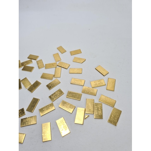 62 - Fifty 22ct gold tooth caps/grills - approx. weight 100 grams