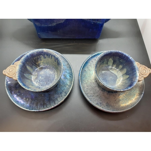 103 - A Leon Leyritz of France blue studio pottery five piece tea set comprising teapot, two cups and two ... 