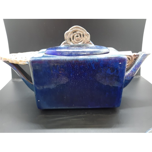 103 - A Leon Leyritz of France blue studio pottery five piece tea set comprising teapot, two cups and two ... 