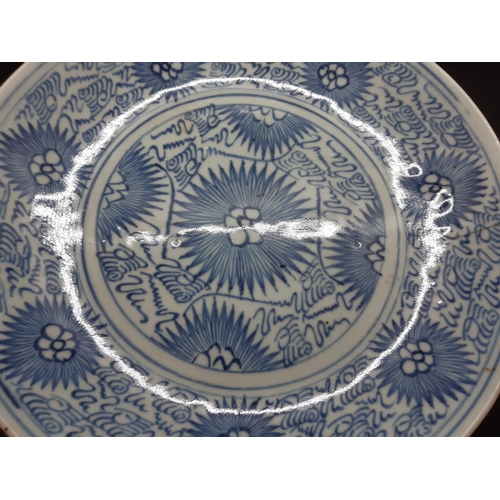 107 - Two 19th century blue and white export porcelain 'Starburst Pattern' wall chargers - measuring appro... 