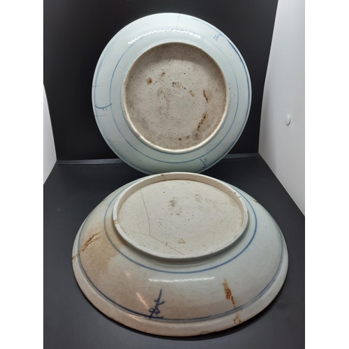 107 - Two 19th century blue and white export porcelain 'Starburst Pattern' wall chargers - measuring appro... 