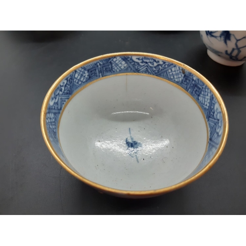 108 - Four 19th century blue and white tea bowls, three having gilded rims