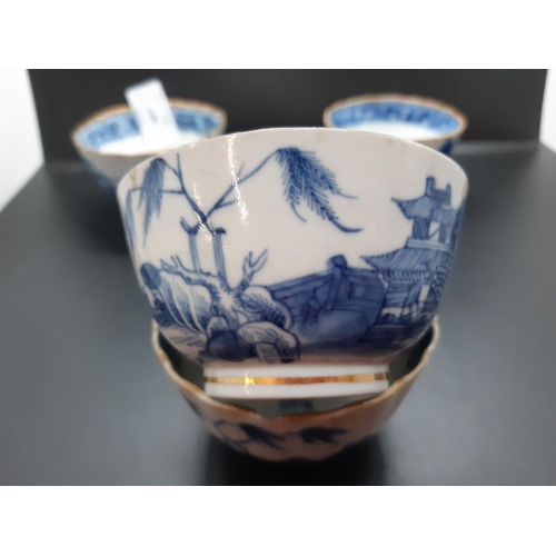 108 - Four 19th century blue and white tea bowls, three having gilded rims