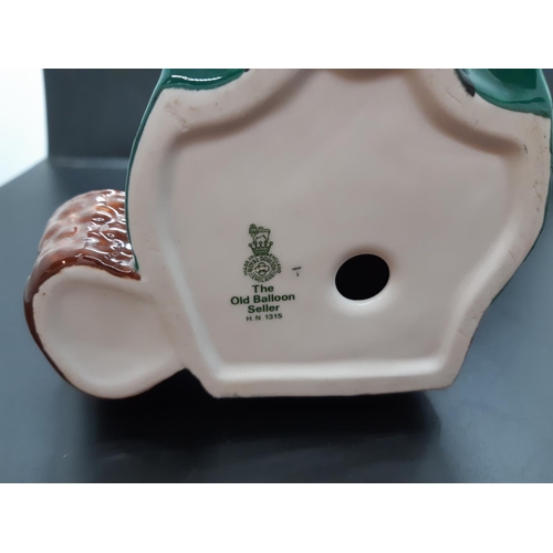110 - A Royal Doulton The Old Balloon Seller figurine - HN 1315