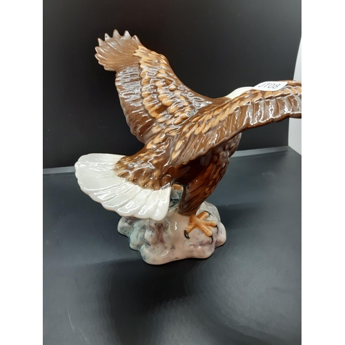 115 - A Beswick Bald Eagle figurine, model no. 1018 - approx. 17cm high x 34cm wide