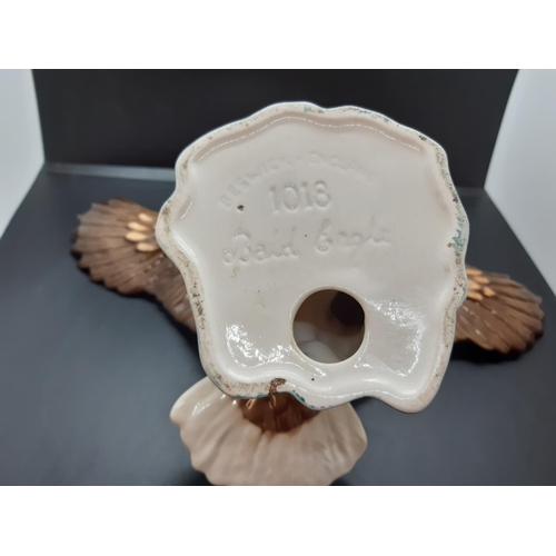 115 - A Beswick Bald Eagle figurine, model no. 1018 - approx. 17cm high x 34cm wide