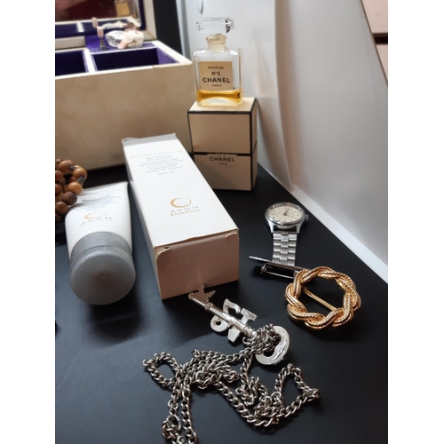 94 - A jewellery box containing costume jewellery, a boxed vintage Chanel No. 5 perfume, Sekonda nurses w... 