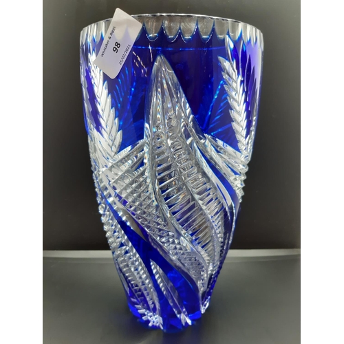98 - A tall Bohemian blue and clear cut crystal vase - approx. 27cm high