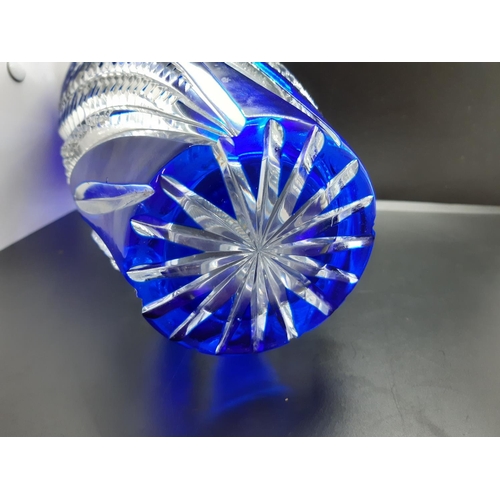 98 - A tall Bohemian blue and clear cut crystal vase - approx. 27cm high