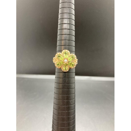 69 - A hallmarked 9ct gold peridot and seed pearl ladies ring - size R ½, gross weight 5.8 grams