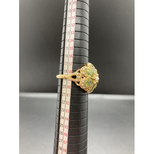 69 - A hallmarked 9ct gold peridot and seed pearl ladies ring - size R ½, gross weight 5.8 grams