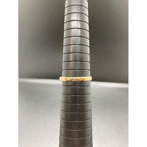 91 - An unmarked gold sapphire and diamond ladies ring with one central sapphire and sixteen surrounding ... 