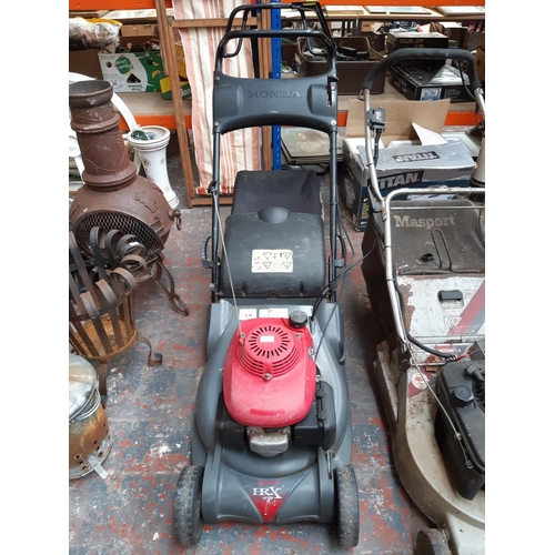 1292 - A red and grey Honda HRX476 petrol lawnmower with grass collector