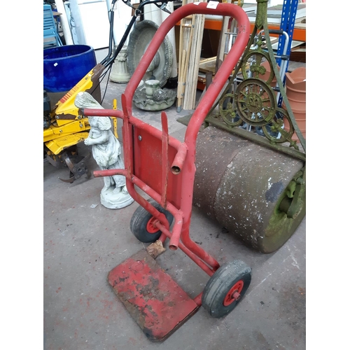 1297 - A red metal two wheeled gas bottle trolley