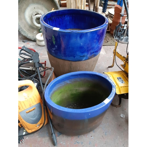 1300 - Two good quality blue glazed terracotta planters, one oval approx. 16