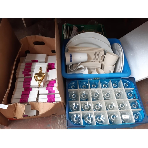 1307 - Four boxes containing wine glasses, brass door knockers, glass jug, kitchenware etc.