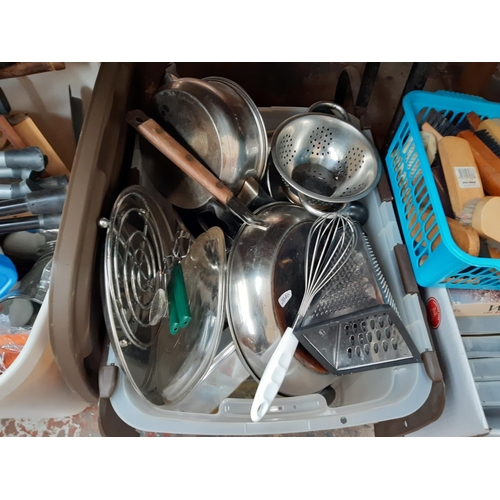 1310 - Six boxes containing stainless steel pans, shoe cleaning brushes, cutlery, glassware etc.