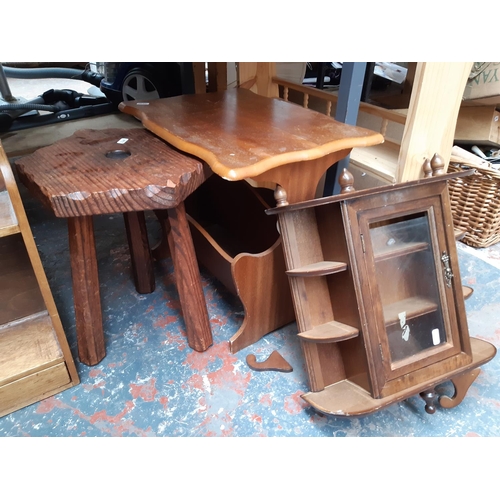 1311 - Eight pieces of small furniture to include wooden milking stool, pine bookcase, small display cases ... 