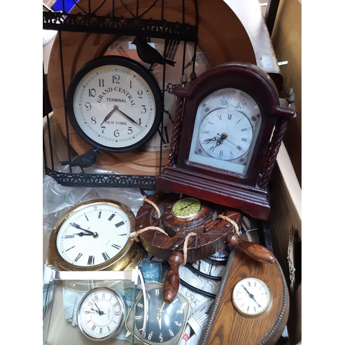 1330 - A box containing brass wall clock, ships wheel thermometer, wooden mantel clock etc.