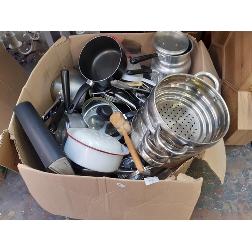 1356 - A large box of kitchenware to include white enamel casserole dish, pressure cooker, stainless steel ... 