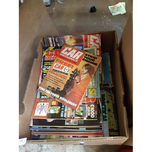 1364 - Three boxes containing 1970s/80s car mechanics magazines, leather satchel, brass ceiling light, book... 