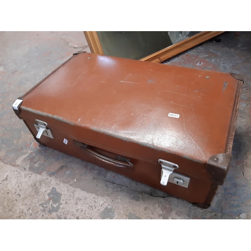 1366 - A brown leather suitcase containing Britannia coffee cups and saucers, boxed Kenwood electric knife,... 