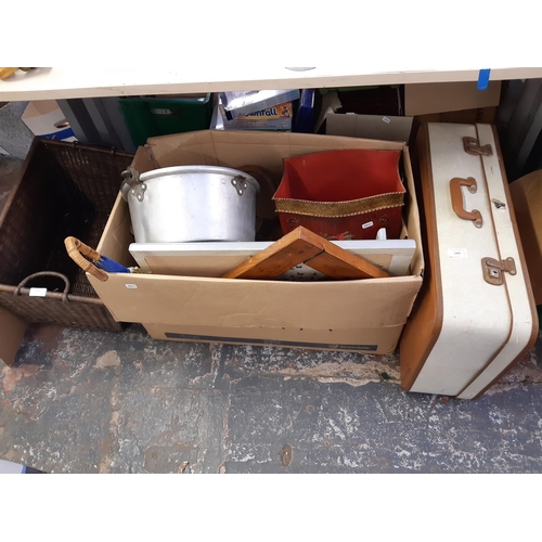 1383 - Three items to include a vintage suitcase, wicker log basket and a box containing aluminium jam pan,... 