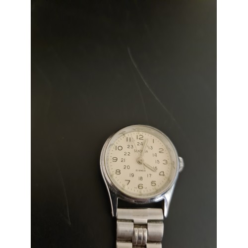 94 - A jewellery box containing costume jewellery, a boxed vintage Chanel No. 5 perfume, Sekonda nurses w... 