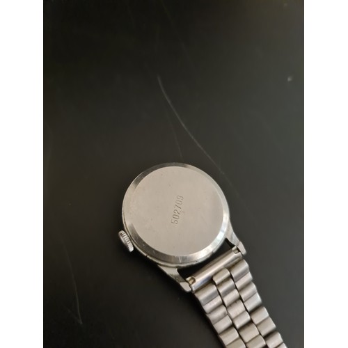 94 - A jewellery box containing costume jewellery, a boxed vintage Chanel No. 5 perfume, Sekonda nurses w... 