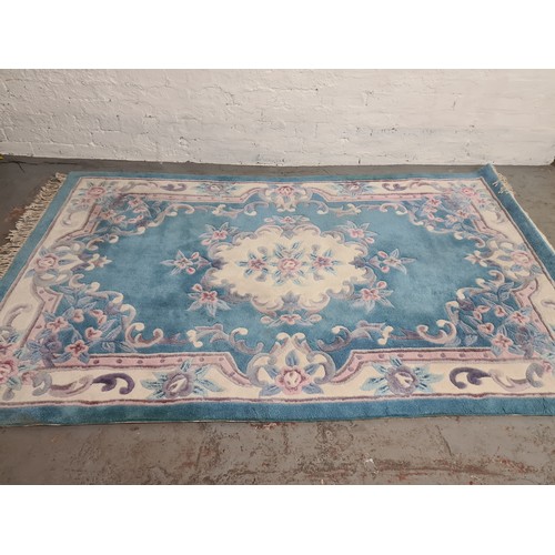 1387 - A large Chinese sapphire acrylic rug - approx. 247cm x 155cm