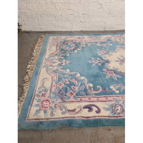 1387 - A large Chinese sapphire acrylic rug - approx. 247cm x 155cm