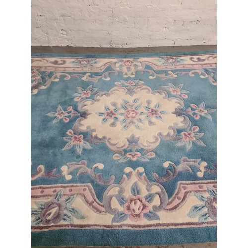 1387 - A large Chinese sapphire acrylic rug - approx. 247cm x 155cm