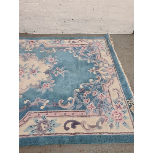 1387 - A large Chinese sapphire acrylic rug - approx. 247cm x 155cm