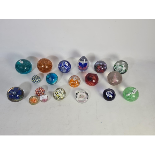 302 - Nineteen various art glass paperweights to include one Caithness Escapade, one Caithness Vortice etc... 