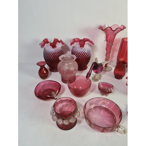 305 - A collection of assorted cranberry glassware