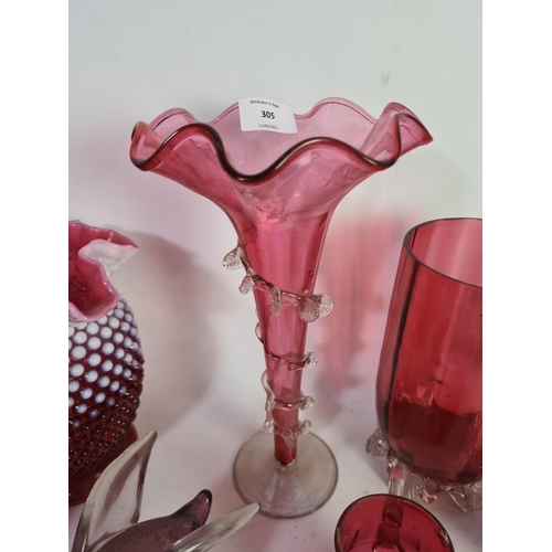 305 - A collection of assorted cranberry glassware