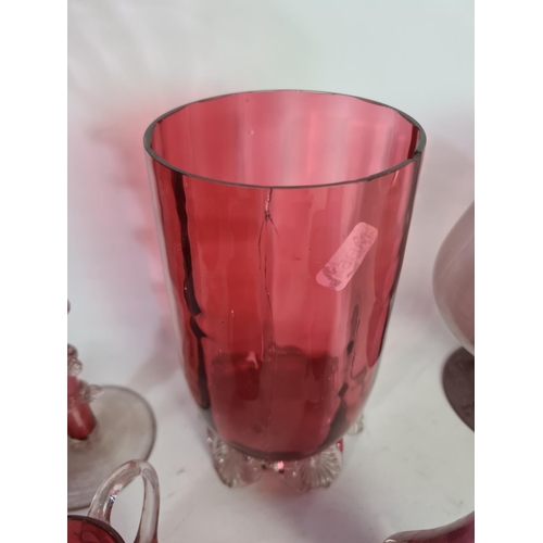 305 - A collection of assorted cranberry glassware