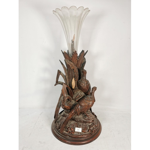 303 - A vintage glass fluted vase with heavily carved oak pheasant design base - approx. 73cm high