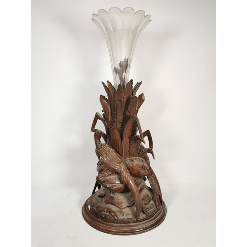 303 - A vintage glass fluted vase with heavily carved oak pheasant design base - approx. 73cm high