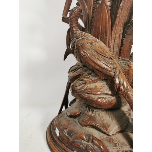 303 - A vintage glass fluted vase with heavily carved oak pheasant design base - approx. 73cm high