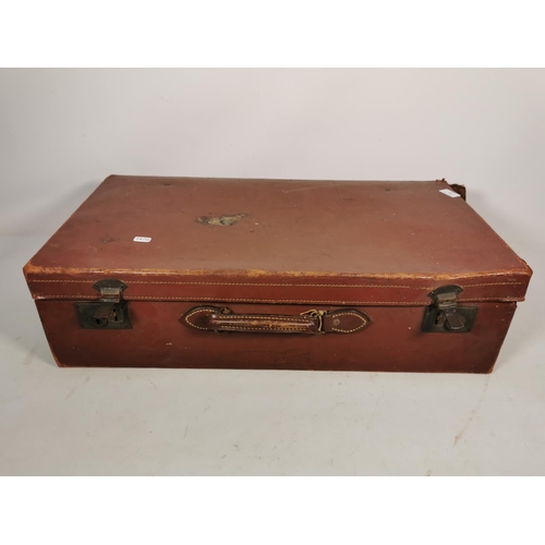 311 - A vintage brown leather suitcase - approx. 20cm high x 71cm wide x 37cm deep