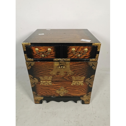 312 - A Korean elm miniature bandaji chest with two upper drawers, fall front and brass fittings - approx.... 