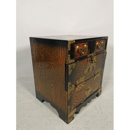 312 - A Korean elm miniature bandaji chest with two upper drawers, fall front and brass fittings - approx.... 