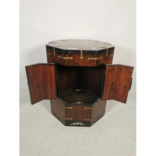 315 - A Korean elm octagonal cabinet with two doors and brass fittings - approx. 43cm high x 34cm wide x 3... 