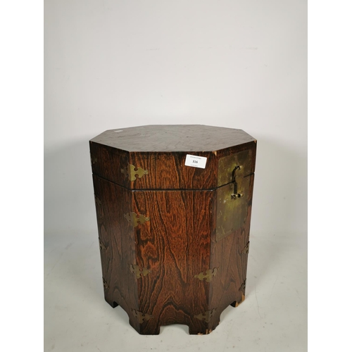 316 - A Korean elm octagonal lidded box with brass fittings and lock - approx. 43cm high x 37cm wide x 37c... 