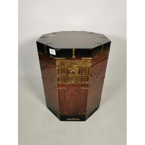 317 - A Korean elm octagonal lidded box with brass fittings - approx. 41cm high x 33.5cm wide x 33.5cm dee... 