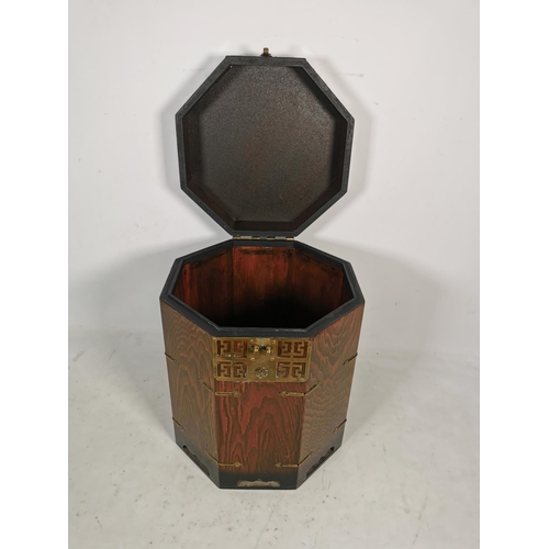 317 - A Korean elm octagonal lidded box with brass fittings - approx. 41cm high x 33.5cm wide x 33.5cm dee... 