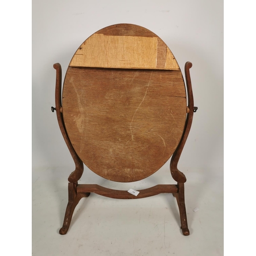 320 - A Victorian mahogany framed swinging circular dressing table mirror